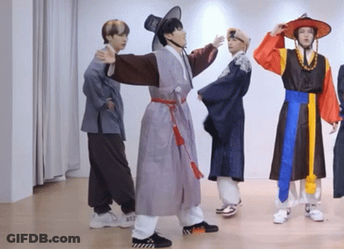 Young Men In Traditional Korean Clothing Dancing GIF