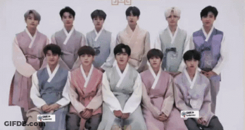 Young Men In Traditional Korean Clothing Posing GIF