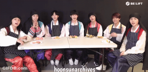 Young Men In Traditional Korean Clothing Posing GIF