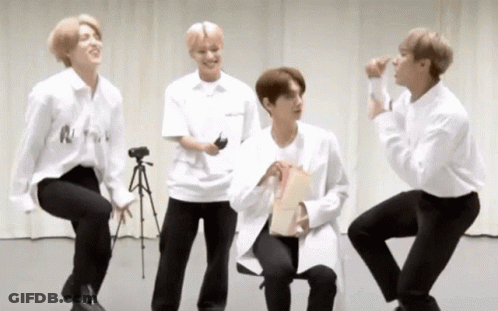 Young Men In White And Black Standing Sitting GIF