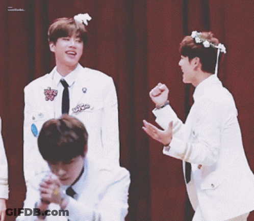 Young Men In White Jackets Waving Hands GIF