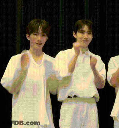 Young Men In White Shirts Raising Hands On Stage GIF