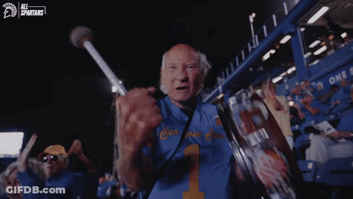 Young Men In Yellow Shirts Cheering In Stadium GIF
