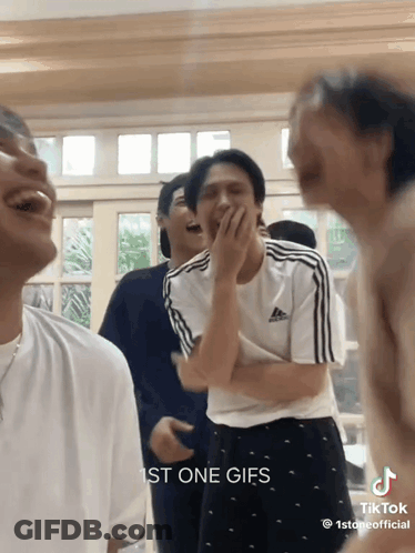 Young Men Laughing Covering Mouths GIF