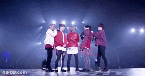 Young Men On Stage With Red Relife Jacket GIF