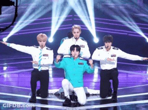 Young Men Performing On Stage With Blue Jacket Saying Captain GIF