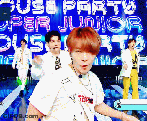 Young Men Performing On Stage With Upper Junior Sign GIF