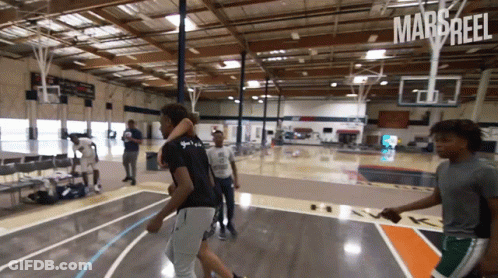 Young Men Playing Basketball GIF