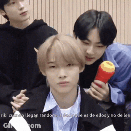 Young Men Posing For Picture With Red Object GIF