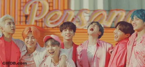 Young Men Posing In Front Of Person Sign GIF