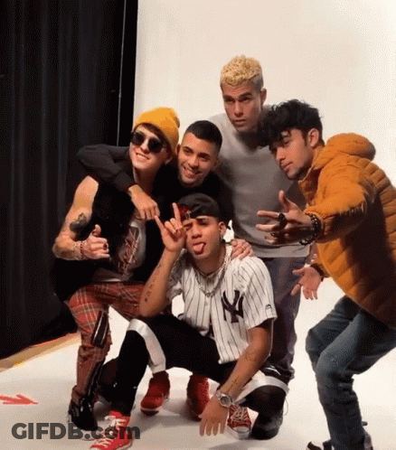 Young Men Posing Including Yankees Jersey GIF