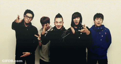 Young Men Posing, One Wearing Blue Jacket GIF