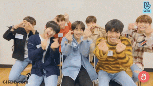 Young Men Posing One With Name Tag A GIF
