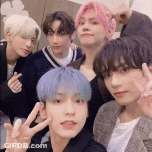 Young Men Posing With Peace Sign GIF