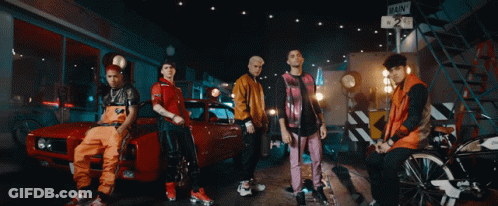Young Men Posing With Red Car GIF