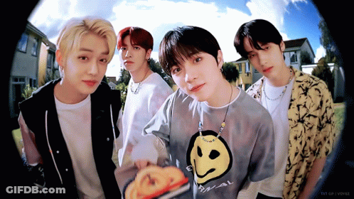 Young Men Posing With Smiley Face Shirt GIF