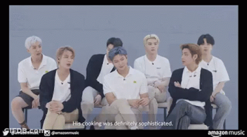 Young Men Sitting And Talking On A Couch GIF