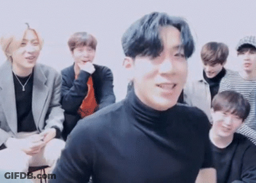 Young Men Sitting Around Table One In Black Turtleneck GIF