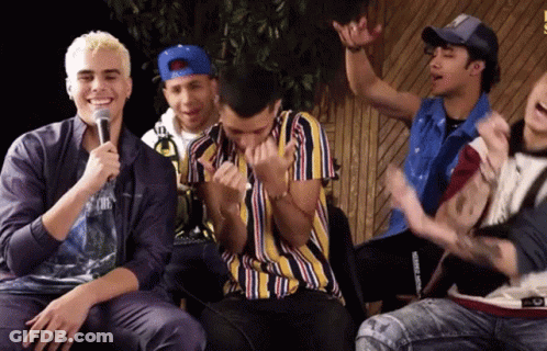 Young Men Sitting At Microphone One In Striped Shirt GIF
