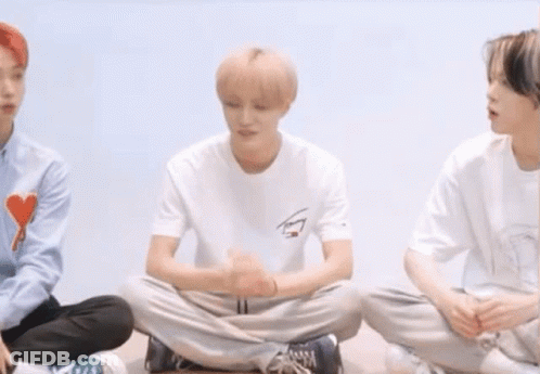 Young Men Sitting In A Circle Cross-Legged GIF
