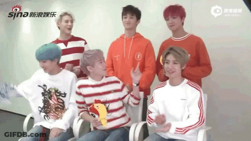 Young Men Sitting In Chairs GIF