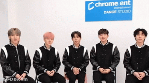 Young Men Sitting In Front Of Chrome Ent Sign GIF