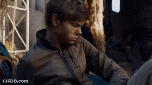 Young Men Sitting In Front Of Wall Saying Clevver GIF