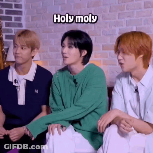 Young Men Sitting Next To Each Other GIF