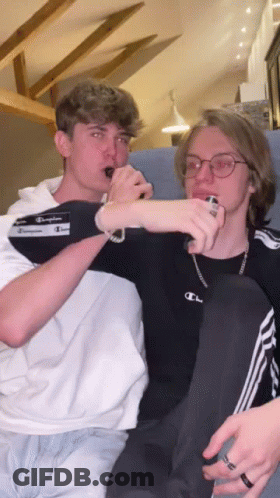 Young Men Sitting On A Couch GIF