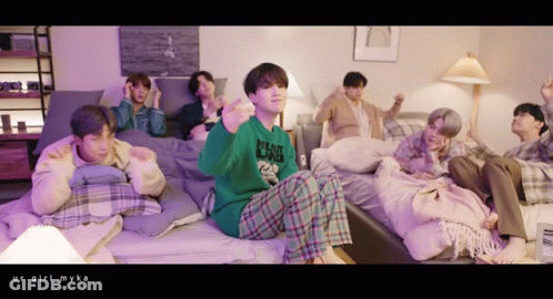Young Men Sitting On Beds Giant Dad Sweater GIF