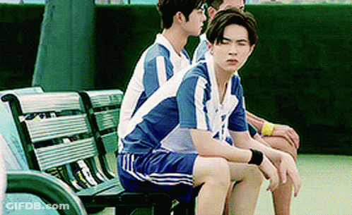 Young Men Sitting On Bench On Tennis Court GIF