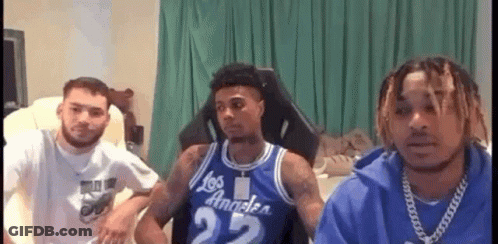Young Men Sitting On Couch In Living Room GIF