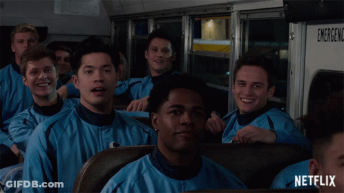 Young Men Sitting On Netflix Bus GIF