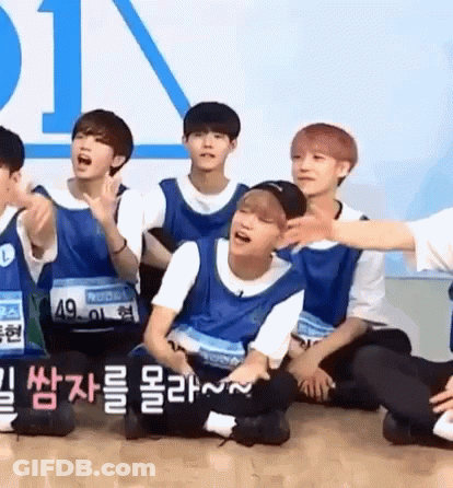 Young Men Sitting One With Number 49 GIF