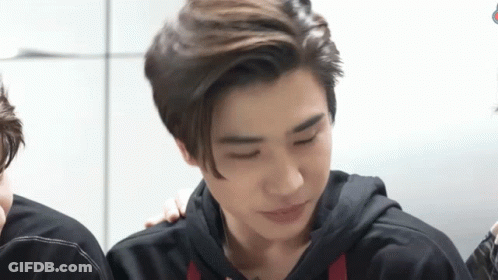 Young Men Sitting Together GIF