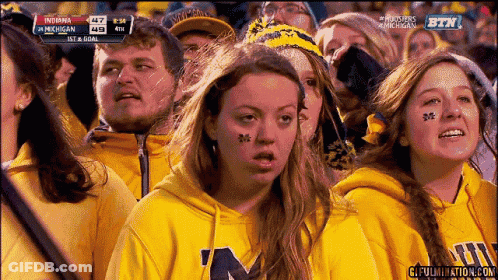 Young Men Standing Around Little Girl With Cane GIF