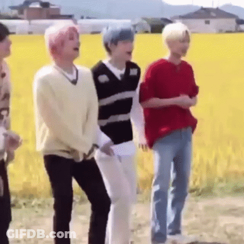 Young Men Standing In Front Of A Field GIF