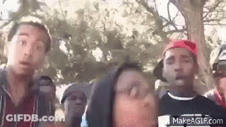 Young Men Standing In Front Of Tree GIF