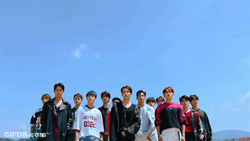 Young Men Standing In Line GIF
