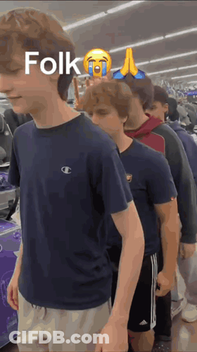 Young Men Standing In Line Saying Folk GIF