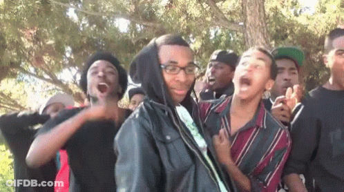 Young Men Standing In Line With Glasses And Hooded Jacket GIF