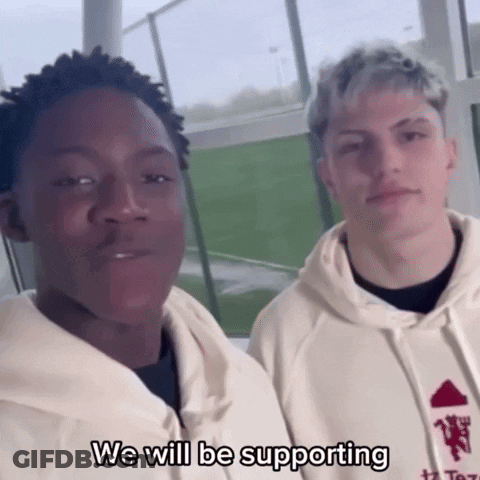 Young Men Standing Next To Each Other GIF