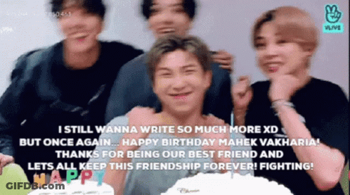 Young Men Standing Next To Each Other In Front Of A Cake GIF