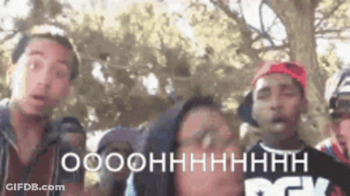 Young Men Standing Next To Each Other GIF
