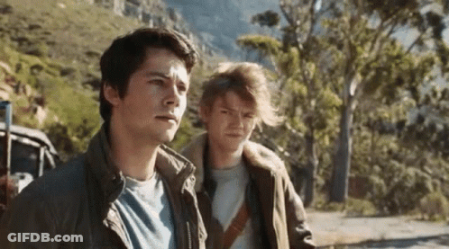 Young Men Standing On Road GIF