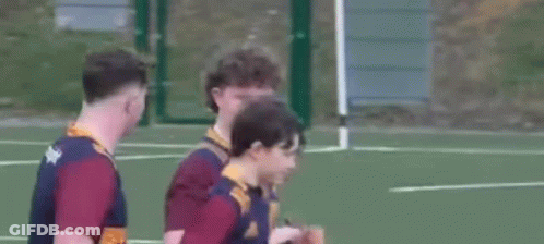 Young Men Standing On Tennis Court GIF