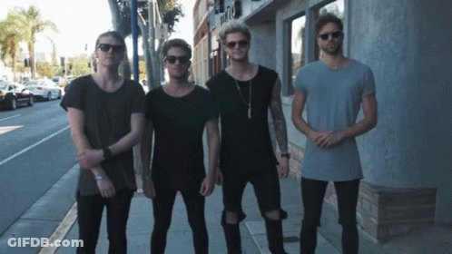Young Men Standing Outside A & A Building GIF