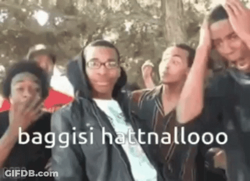 Young Men Standing With Hands On Heads GIF