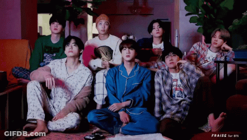 Young Men Watching TV On Couch GIF