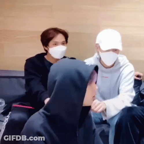 Young Men Wearing Masks Sitting Couch GIF